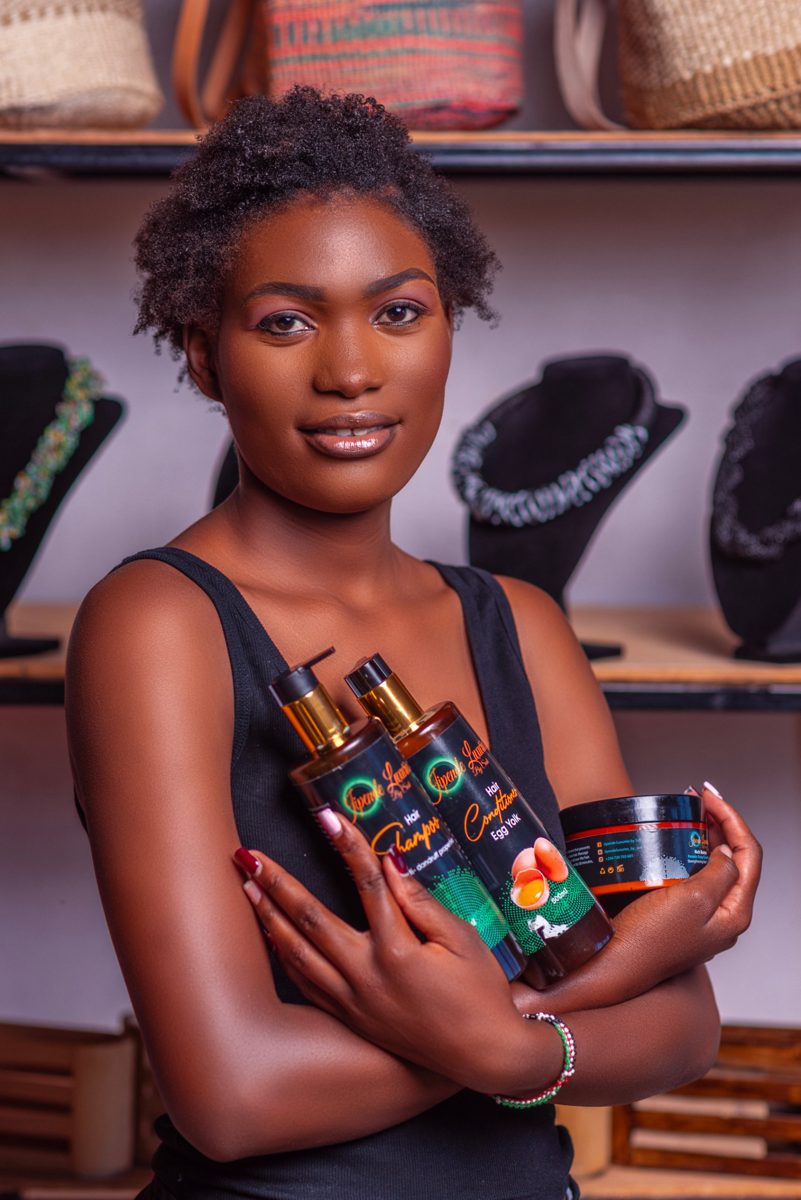 Jipende hair-care products held by a model